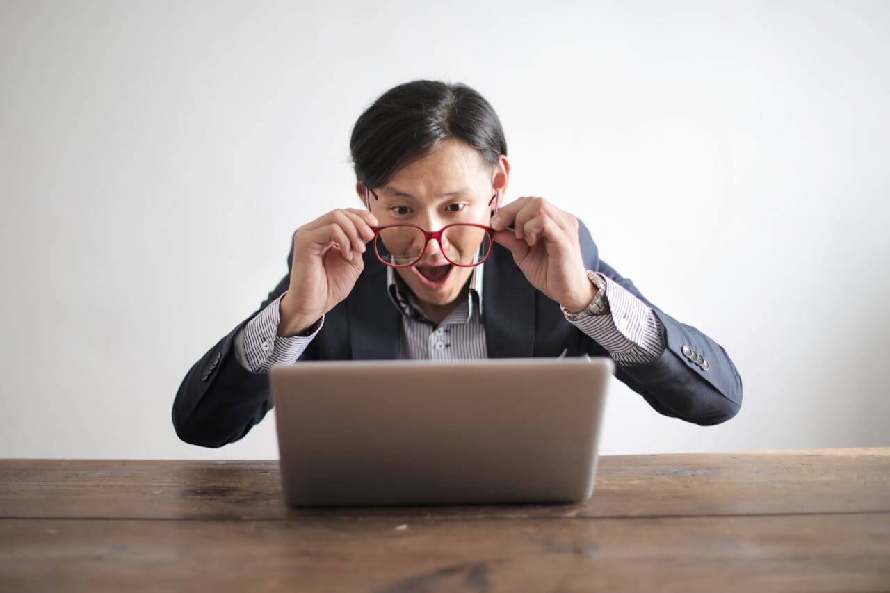 Contractor reviewing payslip and tax deductions while working under an umbrella company, highlighting common tax surprises for UK umbrella contractors